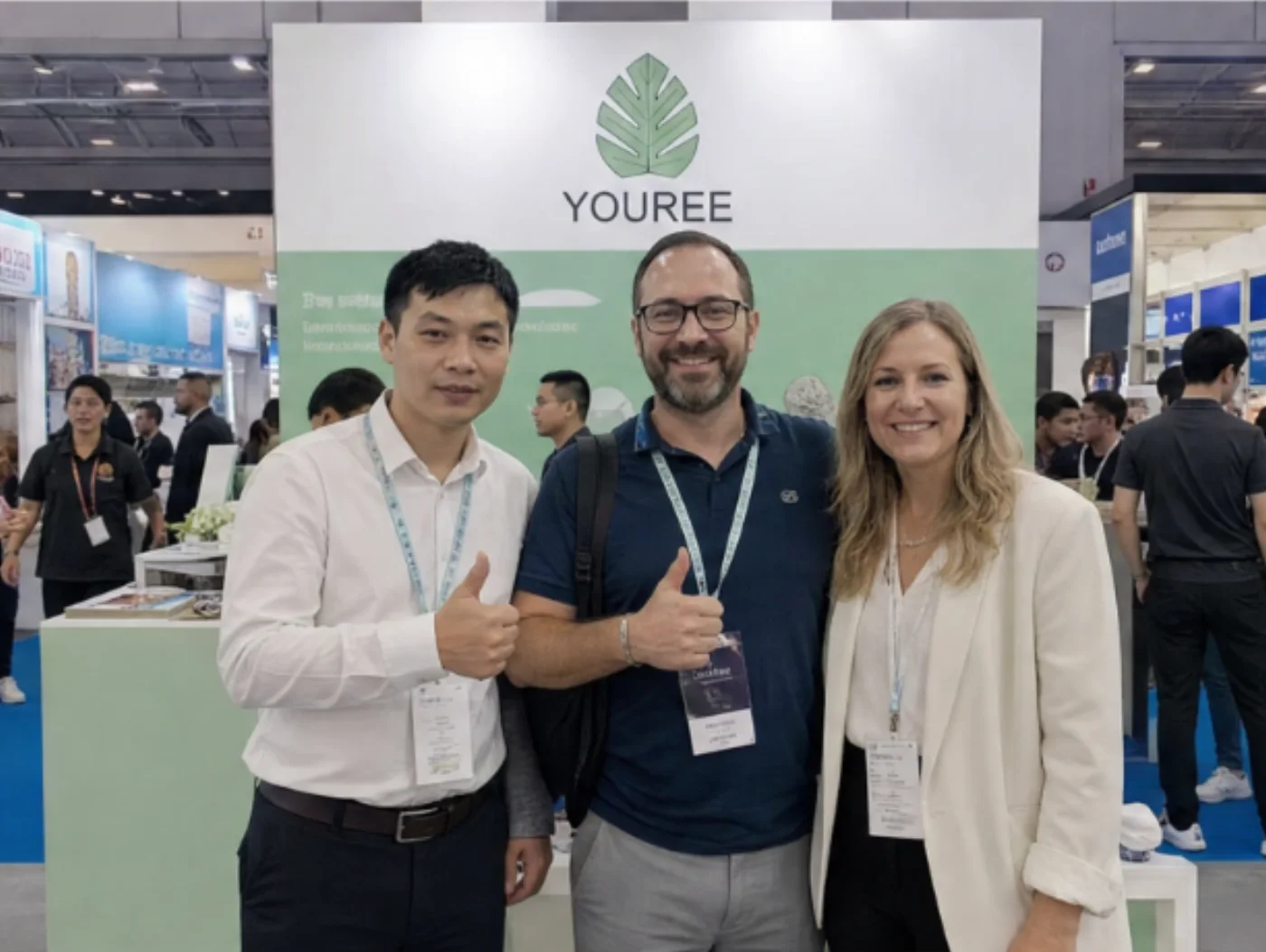 Visitors meeting the YOUREE team at its branded exhibition booth